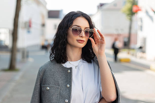 Confident woman strutting down a city street in bold, fashionable attire—embodying the spirit of the Sass Queen Manifesto: Live Bold, Loud & Unapologetic.