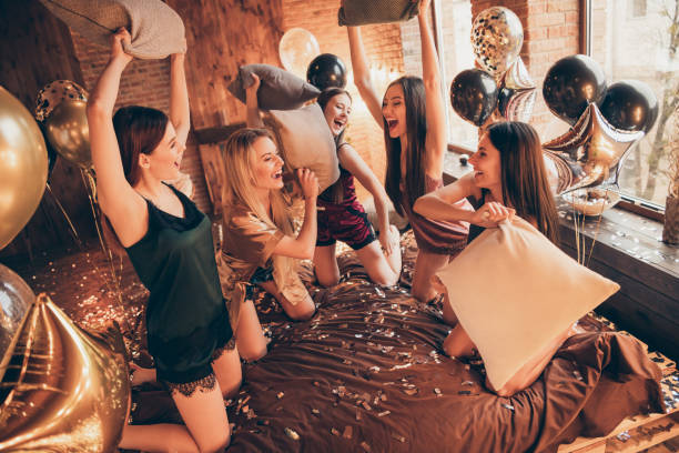 Women laughing while playing Bachelorette Party Games during a bridal celebration.